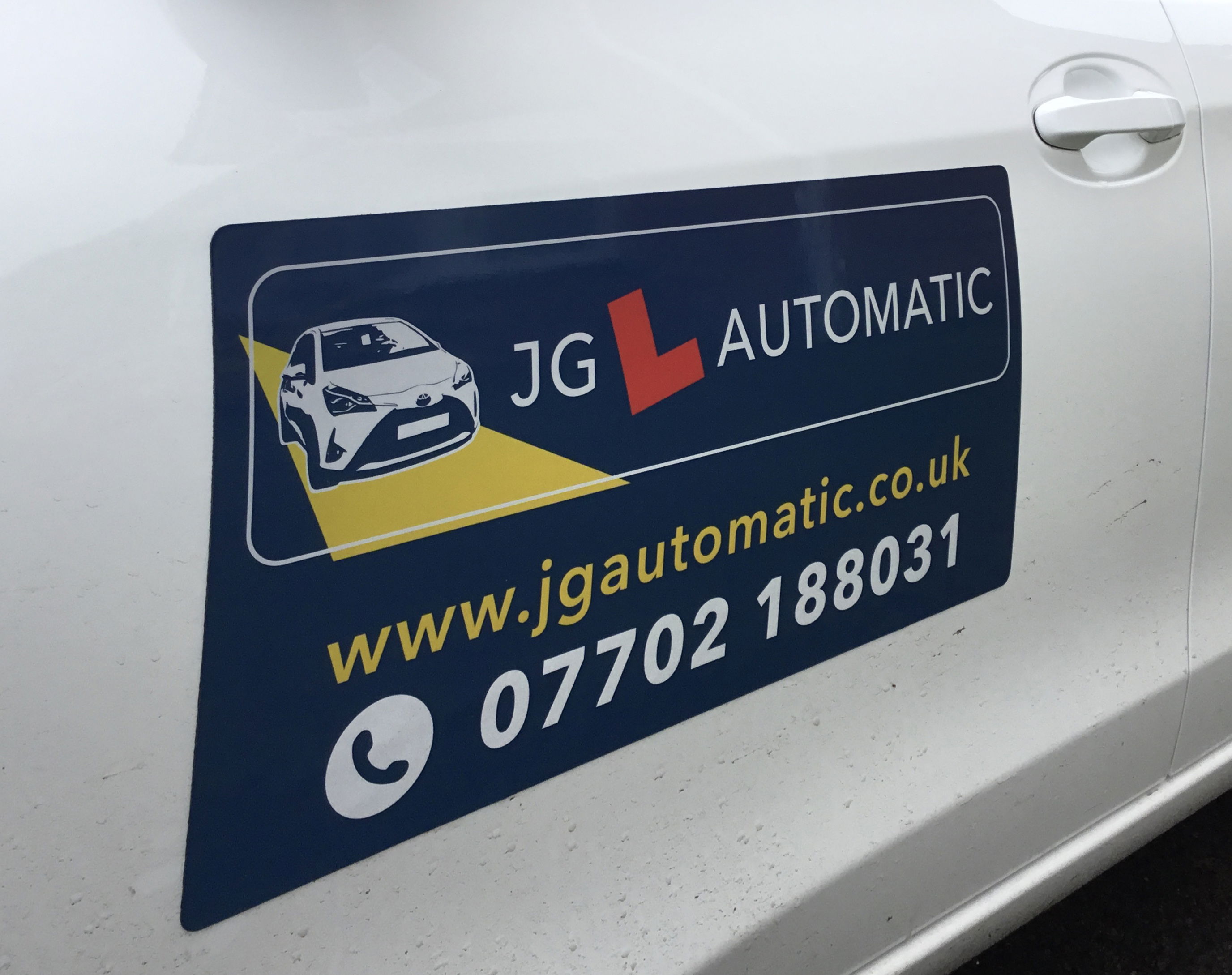 JG Automatic Driving School logo