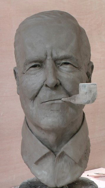 Sculpt a human face in clay